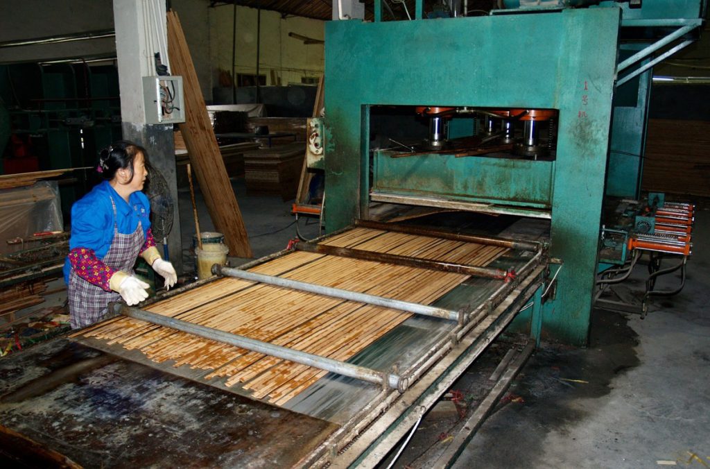 bamboo panel production step 6 pressing bamboo bars into sheets